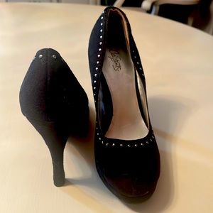 Black platform heels with silver beading.